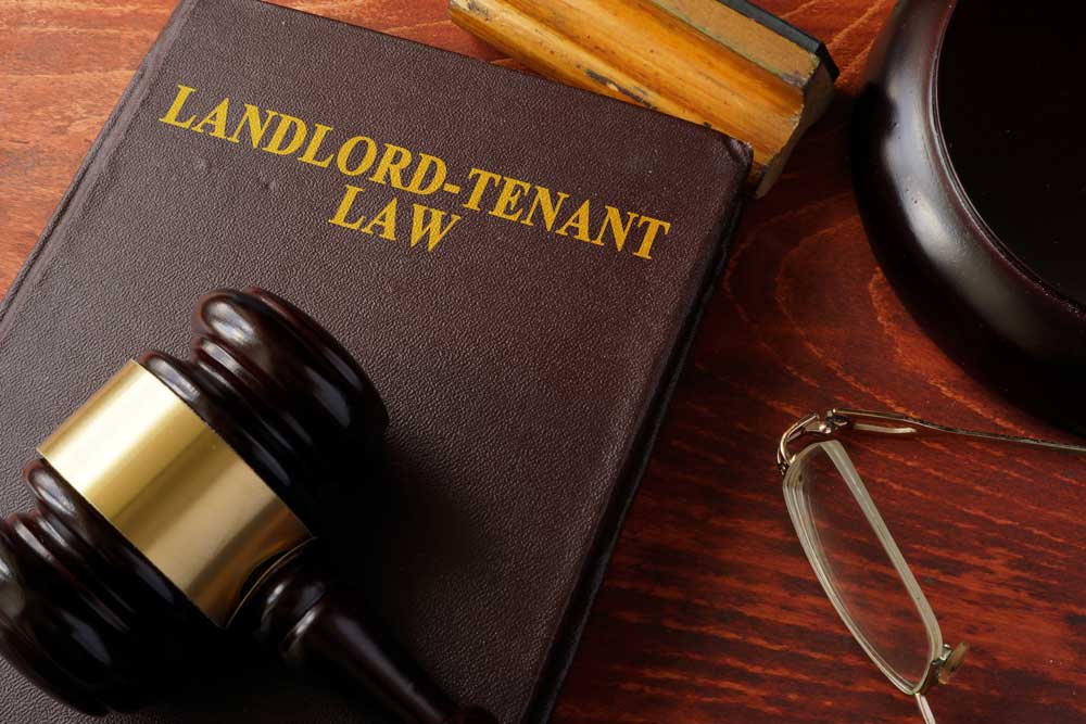 Book and gavel representing landlord and tenant law concept