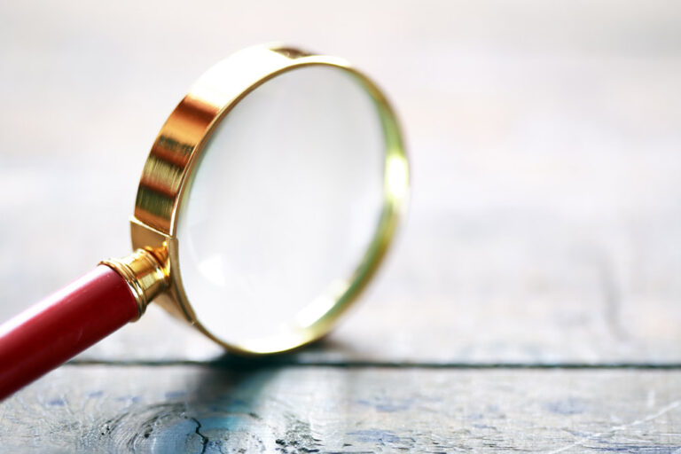 Magnifying glass. Tenant screening concept.