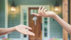 Two hands exchanging keys