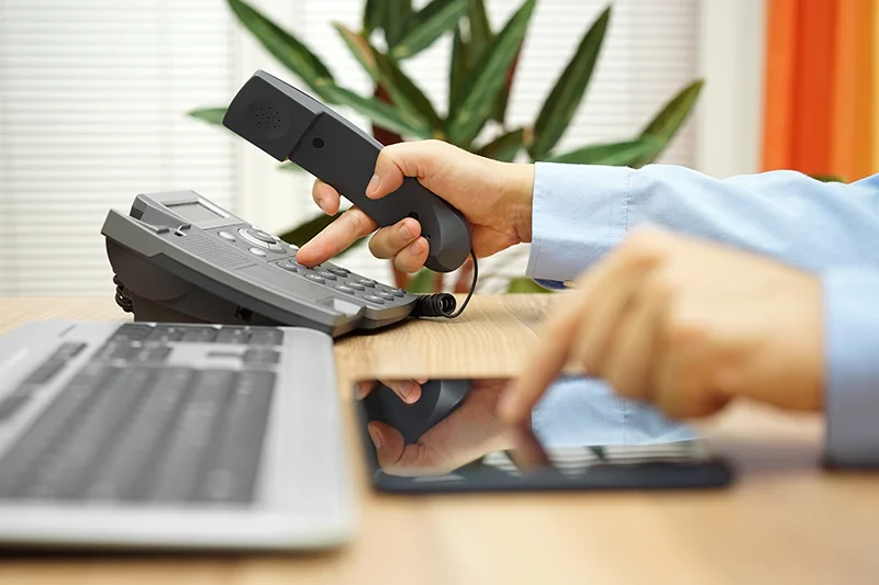 businessman dialing on a phone