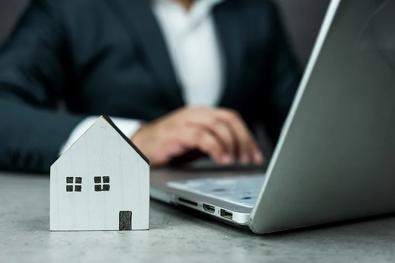 Property manager working on a laptop