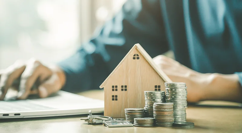 wooden house and cash