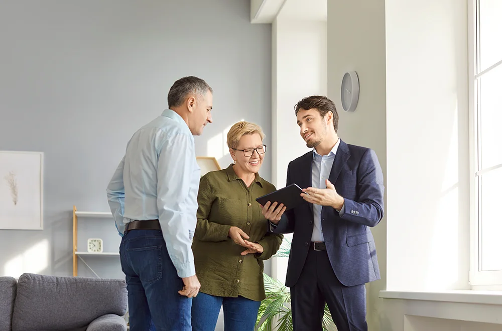 A couple meeting with a property manager.