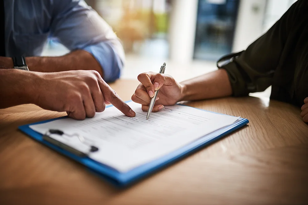 Going over a landlord checklist with a property manager.
