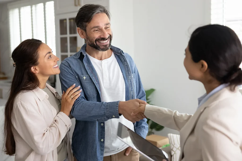 Man shaking hands with a woman