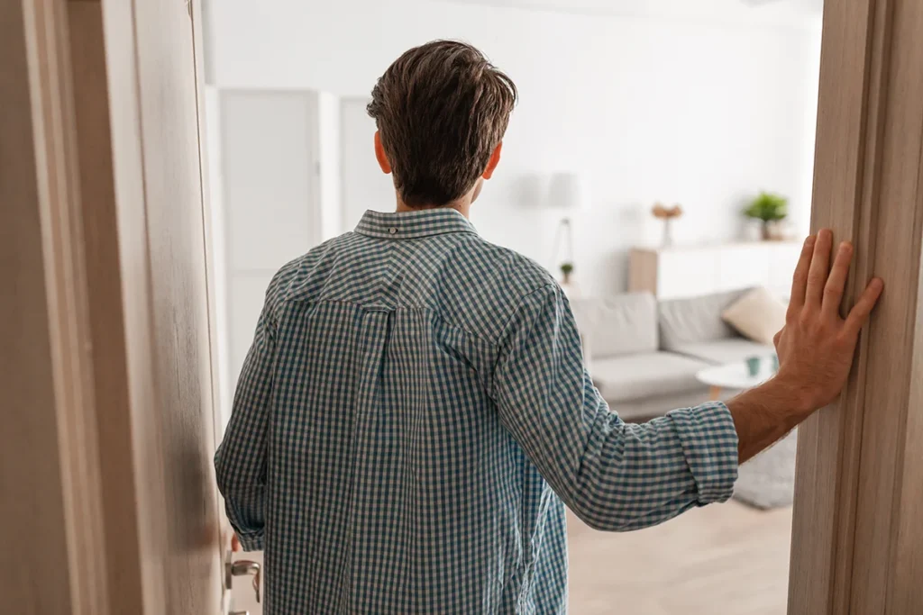 Man doing a walkthrough of a home.