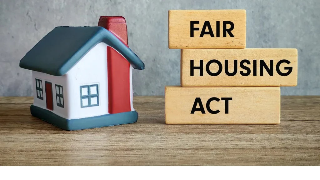 Little model home pictured with the word Fair Housing Act on blocks.