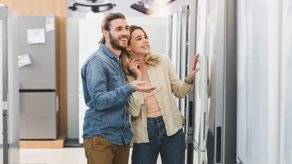 Couple shopping for appliances in a store.