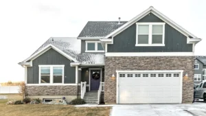 A home pictured with a light dusting of snow