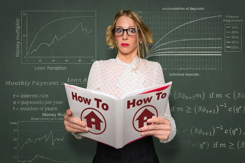 Woman wearing glasses, holding a "How To" book with an image of a house on it.